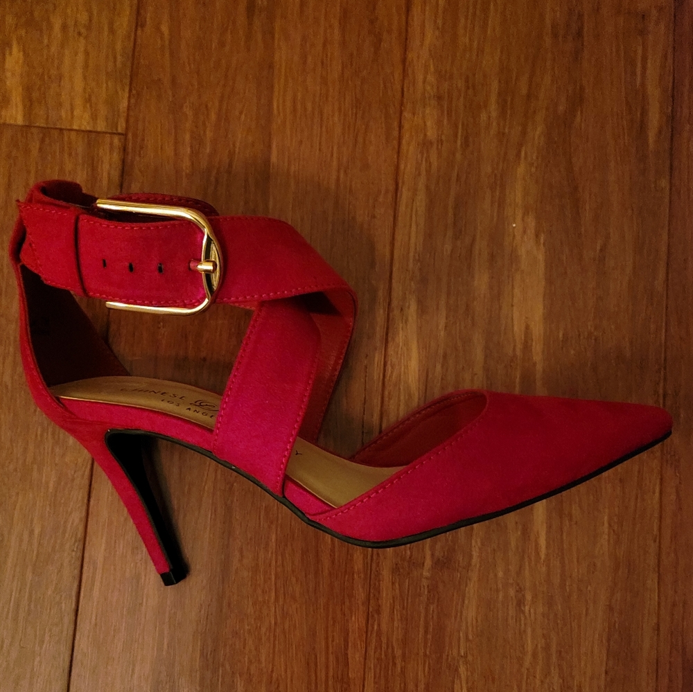 Strappy red suede pumps